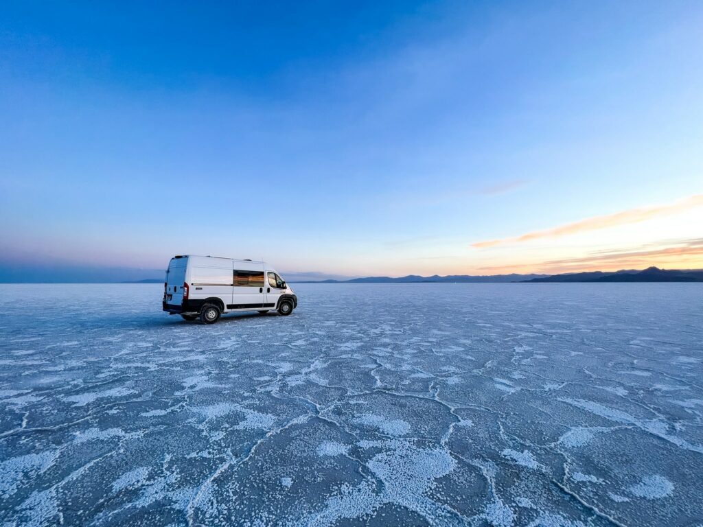 a campervan rental driving in the desert near Salt Lake City