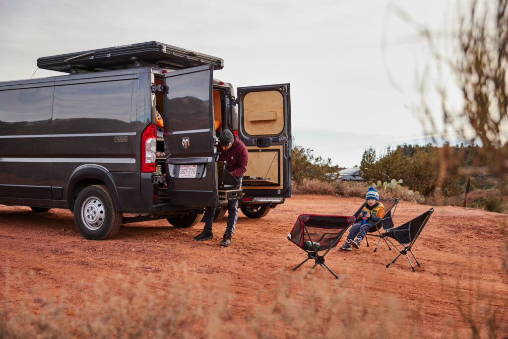 A man hangs out near a Utah camper van rental