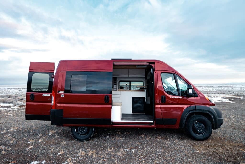 A Red OG Campervan by Native Campervans in the Snow