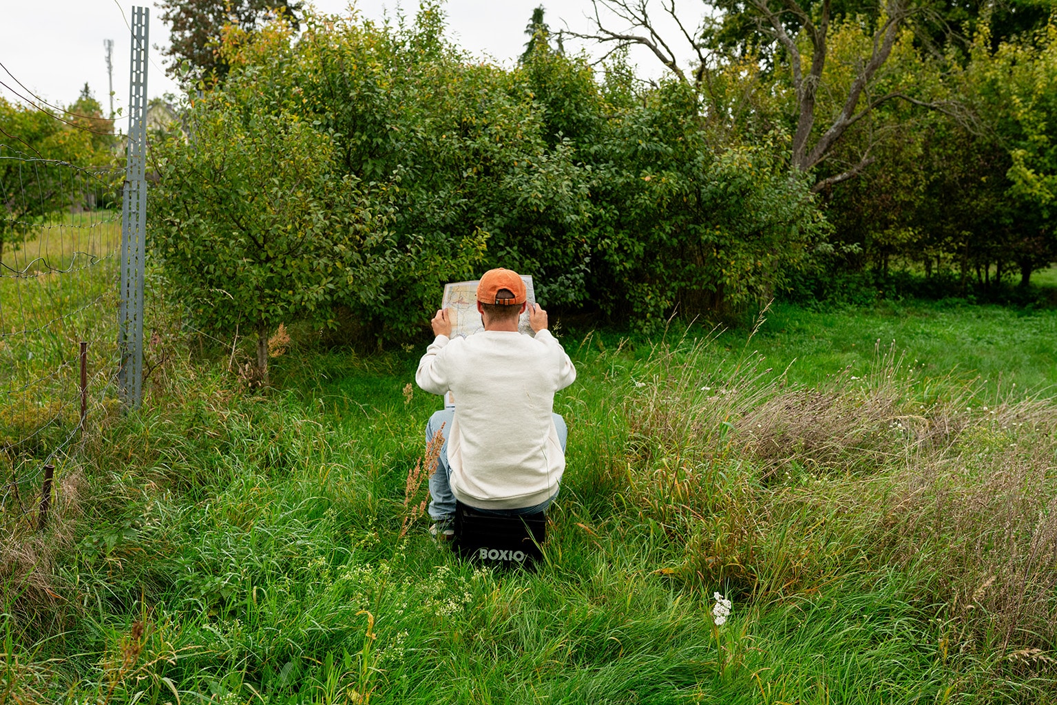 Man using a Boxio Toilet while camping